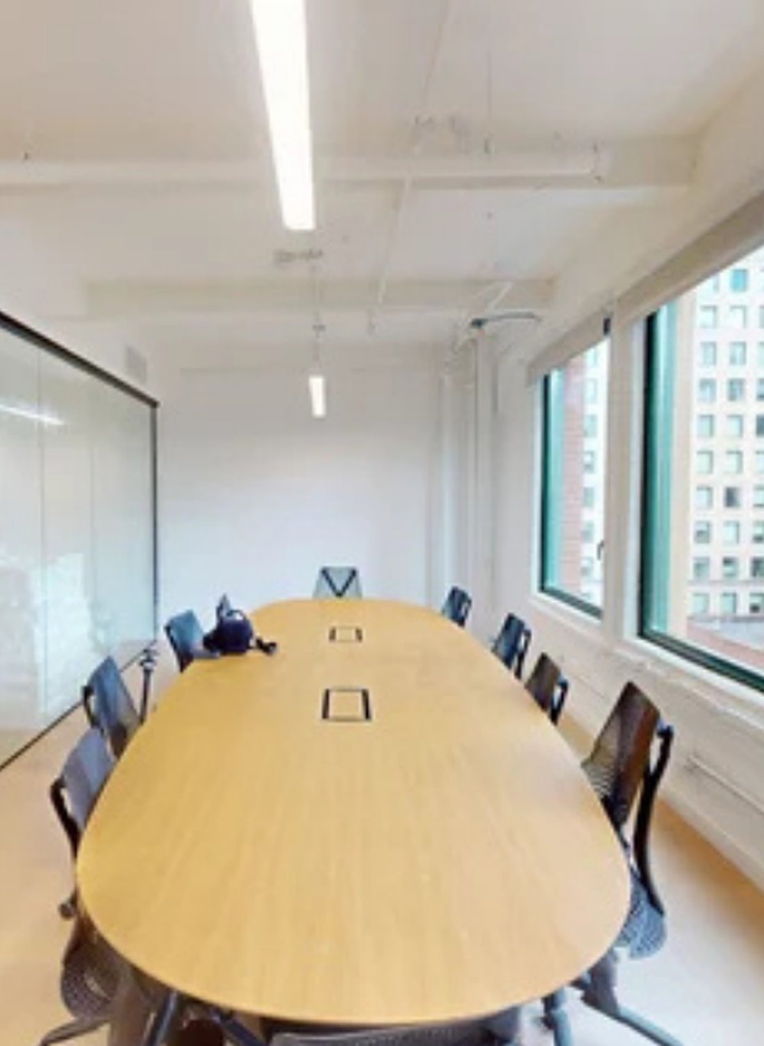 Boardroom beside a run of windows